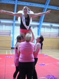 Women in wings being lifted into the air