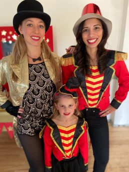 Two party teachers dressed as circus showmen