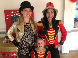 Two party teachers dressed as circus showmen