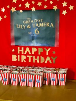 Popcorn packets infront of birthday banner