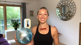 Dancer holding a blue disco ball
