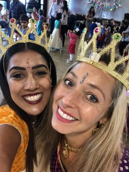 Two Aladdin party teachers with gold crowns on