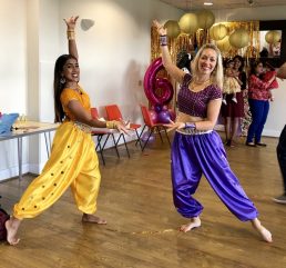 Aladin dance party teachers in a dance pose