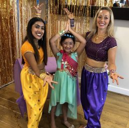 Aladin dance party teacher next to the birthday girl posing