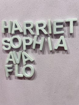 Letters on a board spelling girls names