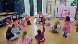 Group of children sitting in a circle at a party