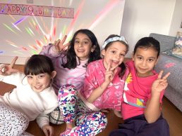 Four girls posing after having their makeup done