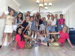 Group of girls posing with props